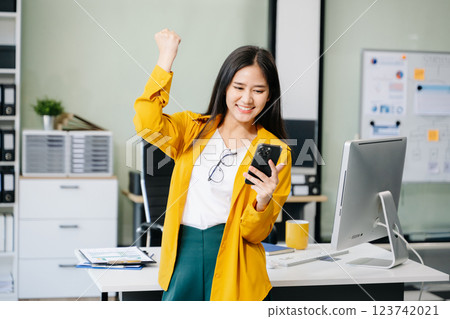 Confident business expert attractive smiling young woman holding digital tablet on desk Confident business expert attractive smiling young woman holding digital tablet on desk 123742021