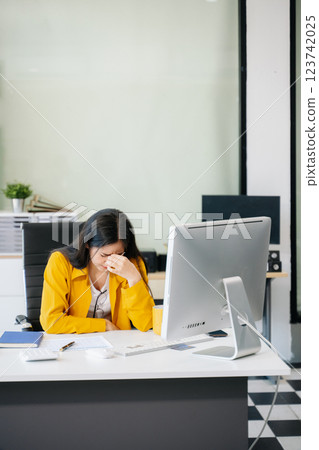 Asian business woman is stressed, bored, and overthinking from working 123742025