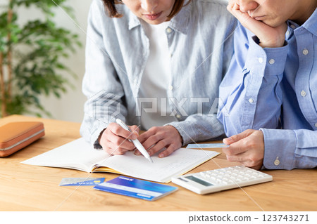 A middle-aged couple keeping a household budget at home 123743271
