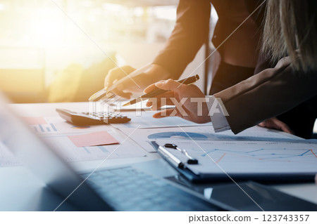Accounting company provide finance and taxation planning for profitable cash flow, Auditor and accountant team working in office, analyze financial data and accounting record with calculator.Insight 123743357