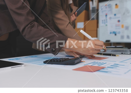 Accounting company provide finance and taxation planning for profitable cash flow, Auditor and accountant team working in office, analyze financial data and accounting record with calculator.Insight Accounting company provide finance and taxation planning for profitable cash flow, Auditor and accountant team working in office, analyze financial data and accounting record with calculator.Insight 123743358