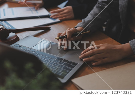 Judge gavel with Justice lawyers having team meeting at law firm background. Concepts of Law and Legal services. Judge gavel with Justice lawyers having team meeting at law firm background. Concepts of Law and Legal services. 123743381