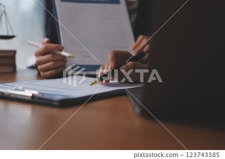 Judge gavel with Justice lawyers having team meeting at law firm background. Concepts of Law and Legal services. 123743385