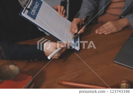Judge gavel with Justice lawyers having team meeting at law firm background. Concepts of Law and Legal services. Judge gavel with Justice lawyers having team meeting at law firm background. Concepts of Law and Legal services. 123743396