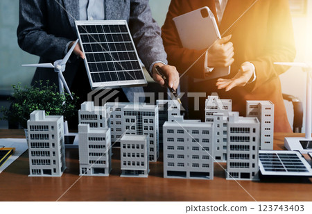 Discussion among businesspeople on the latest developments in solar cell panel technology and Solar Energy Environment city Concept. Discussion among businesspeople on the latest developments in solar cell panel technology and Solar Energy Environment city Concept. 123743403