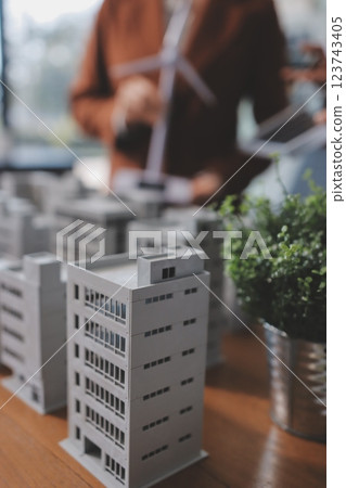 Discussion among businesspeople on the latest developments in solar cell panel technology and Solar Energy Environment city Concept. 123743405