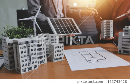 Discussion among businesspeople on the latest developments in solar cell panel technology and Solar Energy Environment city Concept. 123743428