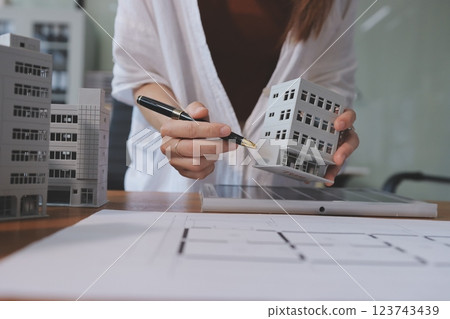 Discussion among businesspeople on the latest developments in solar cell panel technology and Solar Energy Environment city Concept. 123743439