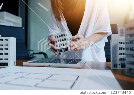 Discussion among businesspeople on the latest developments in solar cell panel technology and Solar Energy Environment city Concept. 123743440