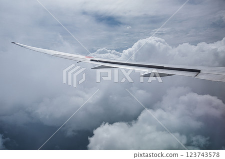 Sea of clouds from the window of an airplane 123743578