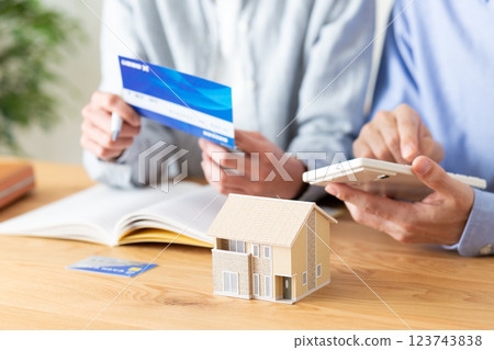 A middle-aged couple keeping a household budget at home 123743838