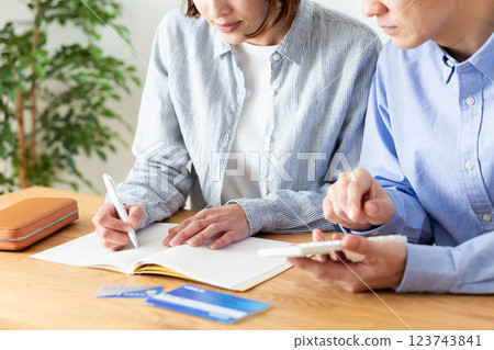 A middle-aged couple keeping a household budget at home 123743841
