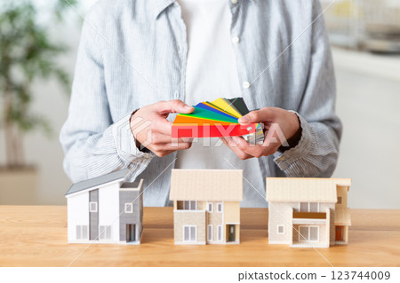 A middle-aged woman doing a color simulation for a home renovation 123744009