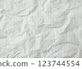 Rumpled lined sheet of paper isolated on white background 123744554