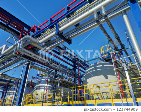 Steel structure is under construction on the construction site against a blue sky backdrop 123744909