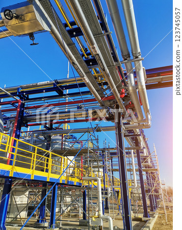 Steel structure is under construction on the construction site against a blue sky backdrop 123745057