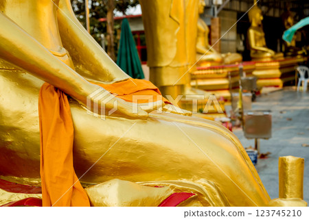 Symbols of Buddhism. Hands of buddist statues. South-Eastern Asia. Details of buddhist temple in Thailand. Symbols of Buddhism. Hands of buddist statues. South-Eastern Asia. Details of buddhist temple in Thailand. 123745210
