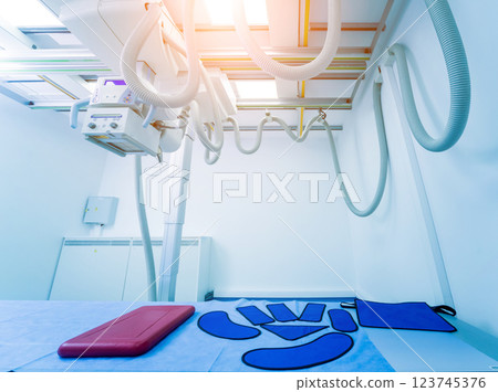 X-ray room in a hospital. Classic ceiling-mounted x-ray system. 123745376