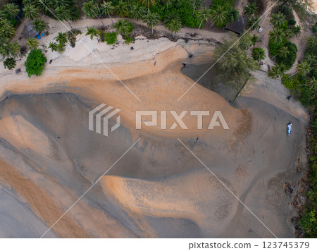 Bird eye view seashore with waves crashing on sand beach,Beautiful waves sea surface in sunset time, Amazing seascape top view seacoast landscape view 123745379