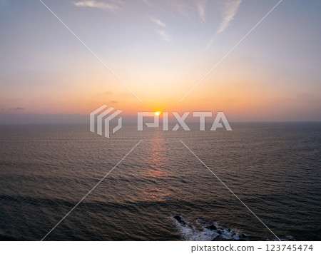 Aerial view sunset sky,Nature beautiful Light Sunset or sunrise over sea,Colorful dramatic majestic scenery sunset Sky with Amazing clouds and waves in sunset sky purple light cloud background 123745474