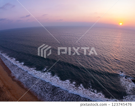 Aerial view sunset sky,Nature beautiful Light Sunset or sunrise over sea,Colorful dramatic majestic scenery sunset Sky with Amazing clouds and waves in sunset sky purple light cloud background 123745476