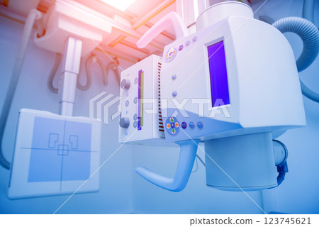 X-ray room in a hospital. Classic ceiling-mounted x-ray system. 123745621