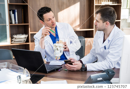 Two doctors having medical council in hospital.  123745707