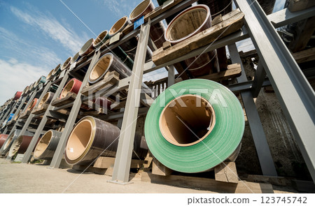 Rolled steel coils in storage areas of metalwork manufacturing. 123745742