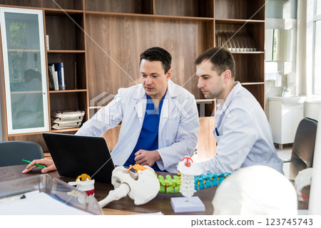 Doctors team having medical council in hospital. Discussing medical issues. 123745743