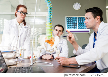 Doctors team having medical council in hospital.  123745750