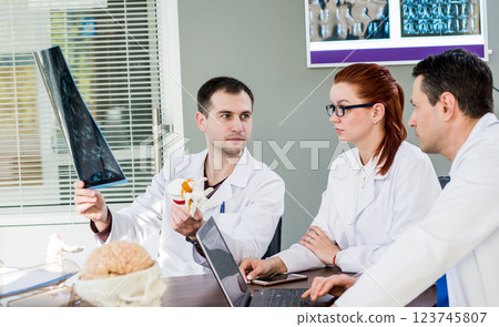 Doctors team having medical council in hospital.  123745807