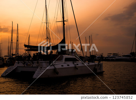 Beautiful view of marina and harbor with yachts and motorboats. Beautiful view of marina and harbor with yachts and motorboats. 123745852
