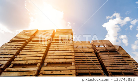 Wooden boxes stacked on each other. Outdoors. Blue sky background Wooden boxes stacked on each other. Outdoors. Blue sky background 123745888