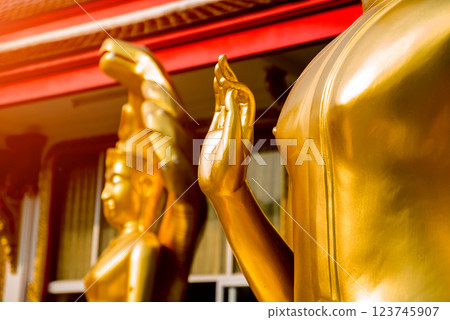 Symbols of Buddhism. Hands of buddist statues. South-Eastern Asia. Details of buddhist temple in Thailand. Symbols of Buddhism. Hands of buddist statues. South-Eastern Asia. Details of buddhist temple in Thailand. 123745907