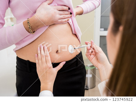 Doctor makes an injection of insulin with a catheter. Doctor injects insulin to a patient with diabetes through a catheter. Diabetes concept. 123745922