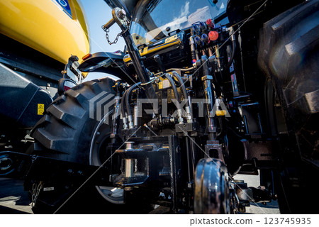 Rear view of modern agricultural tractor. Industrial details. Rear view of modern agricultural tractor. Industrial details. 123745935