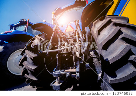 Rear view of modern agricultural tractor. Industrial details. Rear view of modern agricultural tractor. Industrial details. 123746052