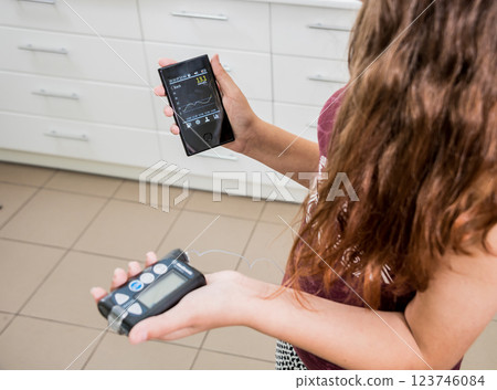 Medical device for glucose check. Continuous glucose monitoring pod. Modern wireless technology. 123746084