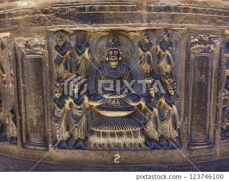 Small sculptures depicting the life of Buddha carved into the body of a small stupa on display at the Lahore Museum in Pakistan 123746100