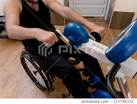 Disabled man training in the gym. Rehabilitation center Disabled man training in the gym. Rehabilitation center 123746152