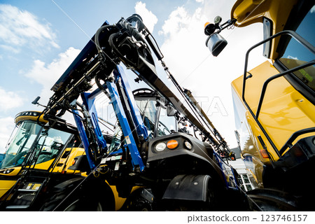 Modern agricultural machinery and equipment. Yellow agricultural harvester. Modern agricultural machinery and equipment. Yellow agricultural harvester. 123746157