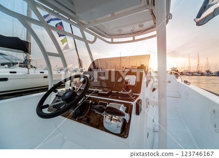 A modern speed boat yacht steering wheels. 123746167