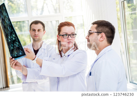 Doctors team having medical council in hospital. Discussing medical issues. 123746230