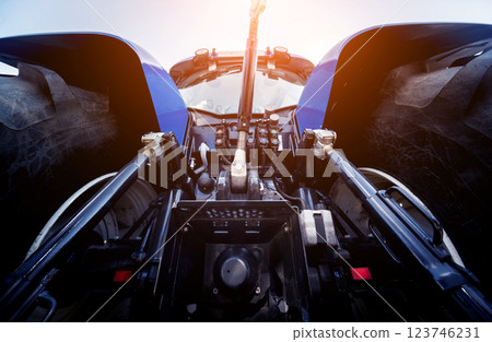 Rear view of modern agricultural tractor. Industrial details. 123746231