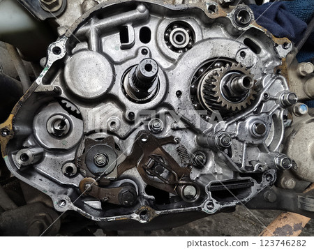 A motorcycle engine that highlights its intricate and complex mechanical components in detail 123746282