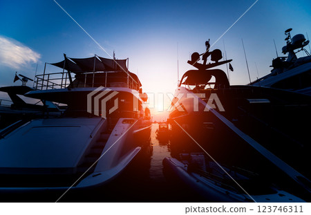 View of harbor with yachts details. Beautiful sunset sky in the marina bay. 123746311