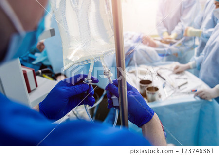 Arthroscope surgery. Orthopedic surgeons in teamwork in the operating room 123746361