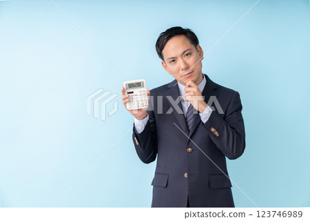 Man holding a calculator Business trouble 123746989