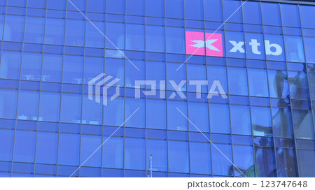 Warsaw, Poland. 22 February 2025. Urban landscape. XTB logo sign on glass wall. Company signboard XTB. 123747648