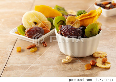 Dried tropical fruits with various nuts and raisins. 123747844
